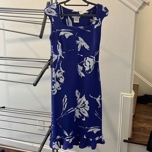 Blue with white flowers. Beautiful and flattering cut!